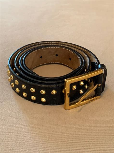 burberry belt with 3 spikes.